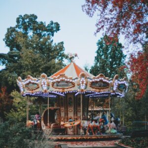 Carousel surrounded with green trees